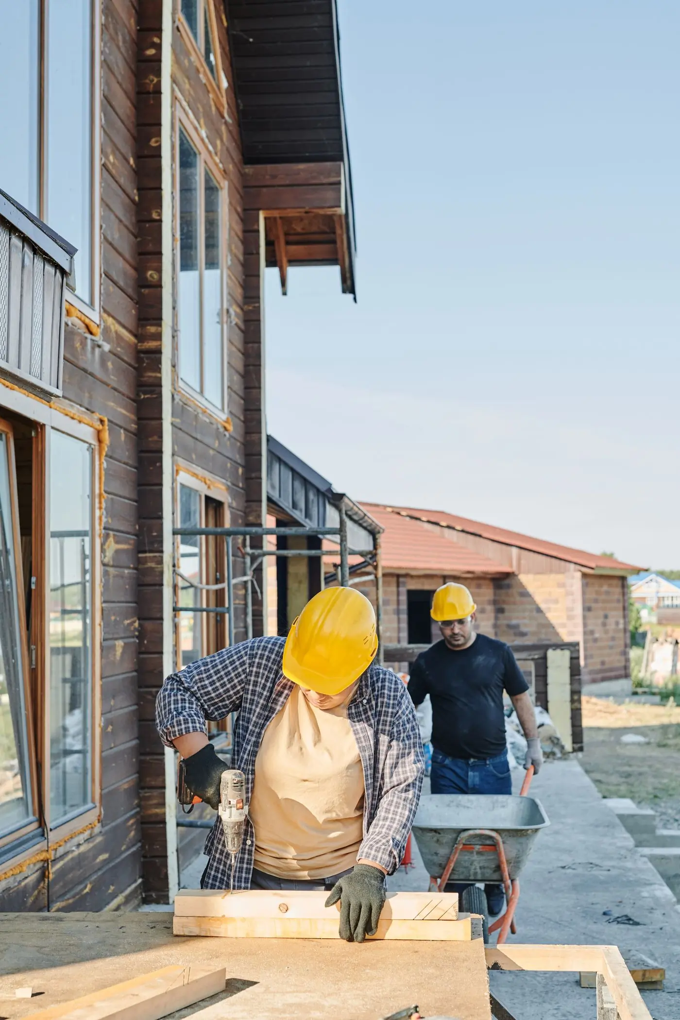 Two of the crew working on a timber structure on site