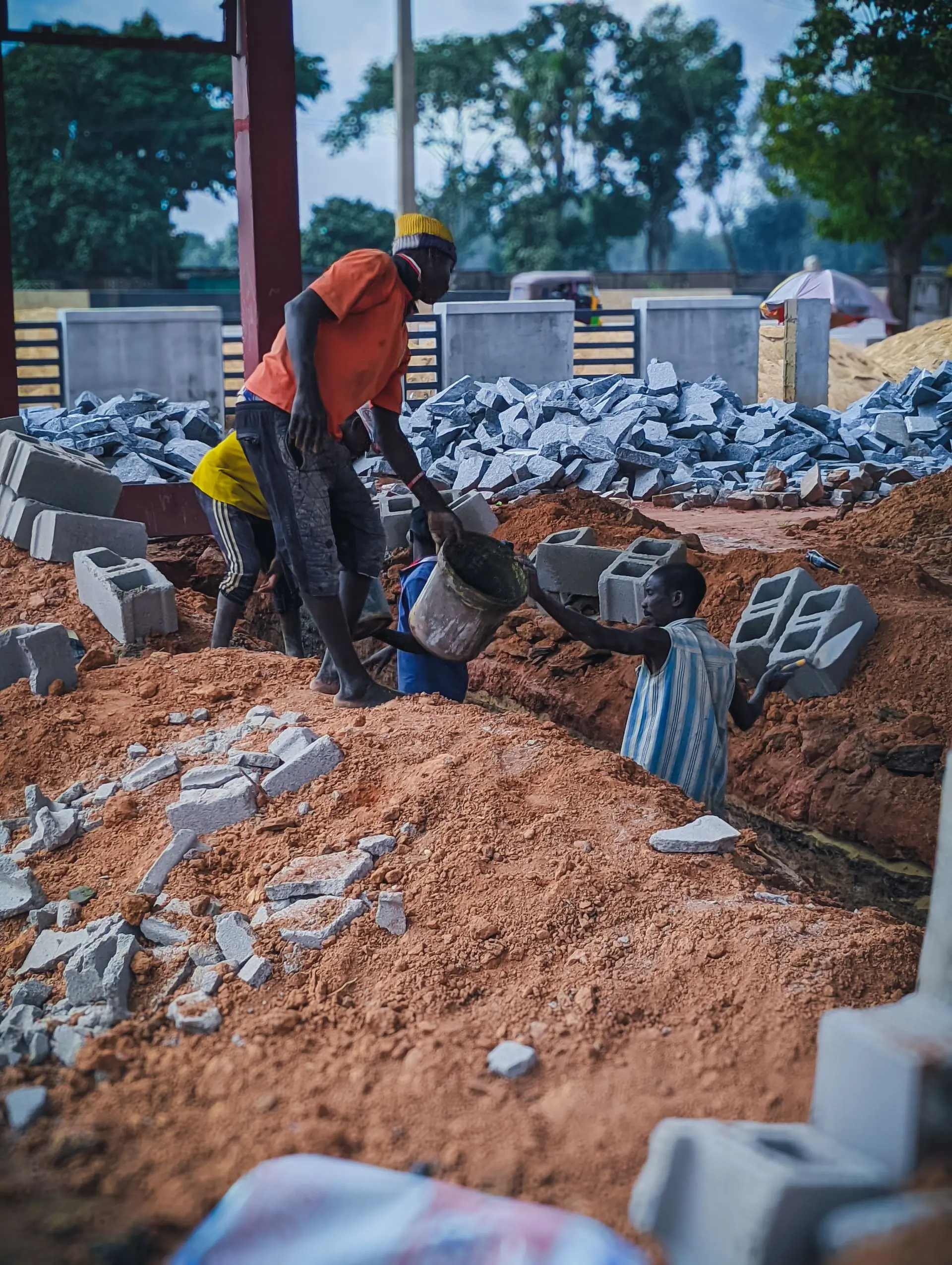 A crew laying the foundations of a building