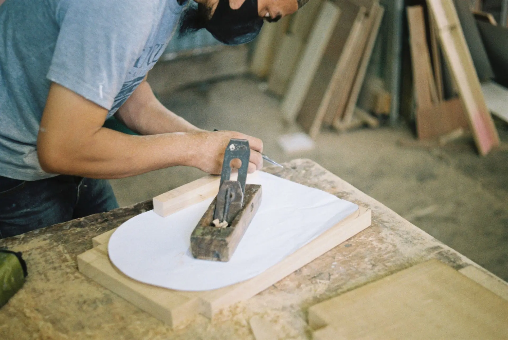 A joiner marking out a length of timber on the bench