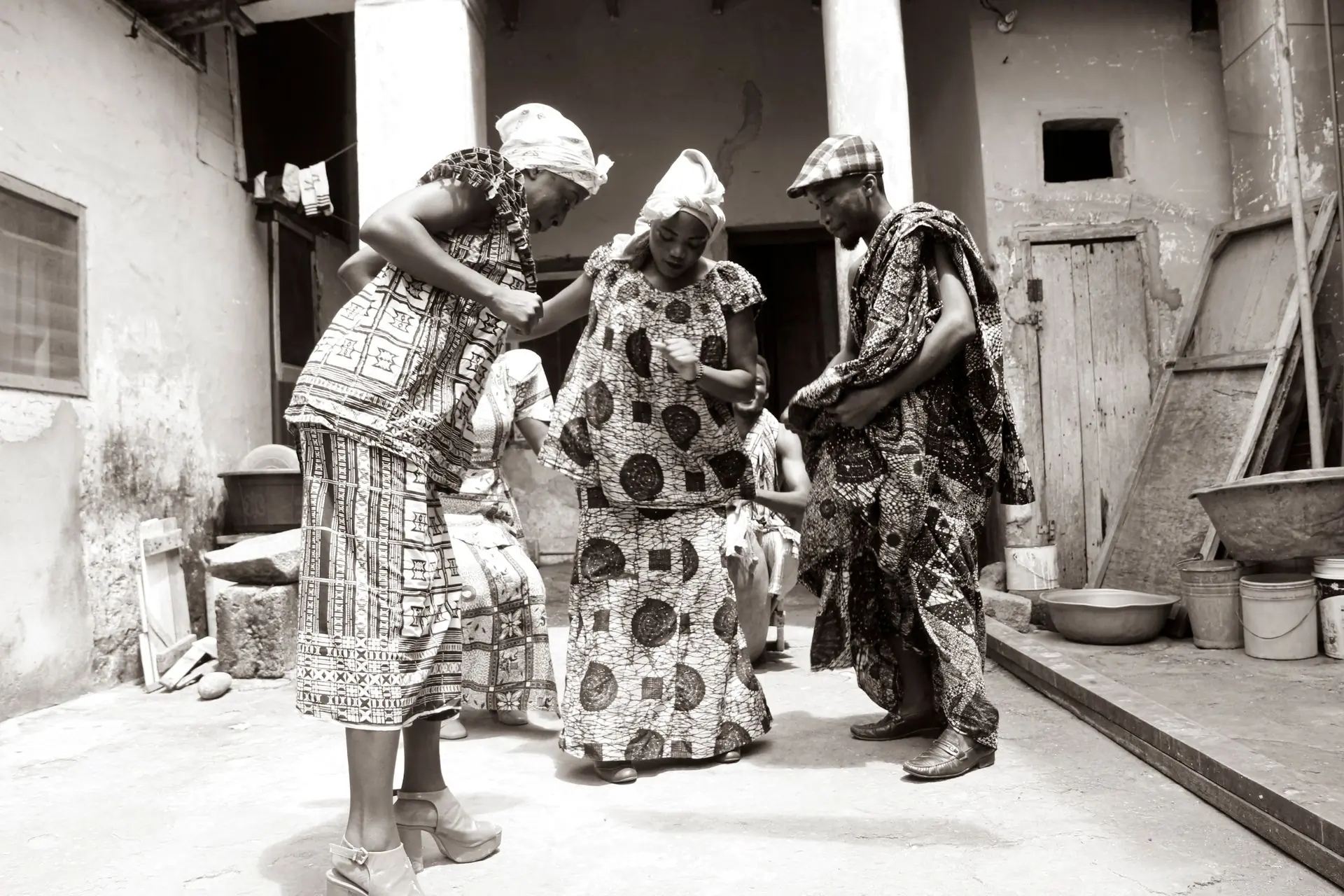 Guests dancing together in traditional cloth at a ceremony