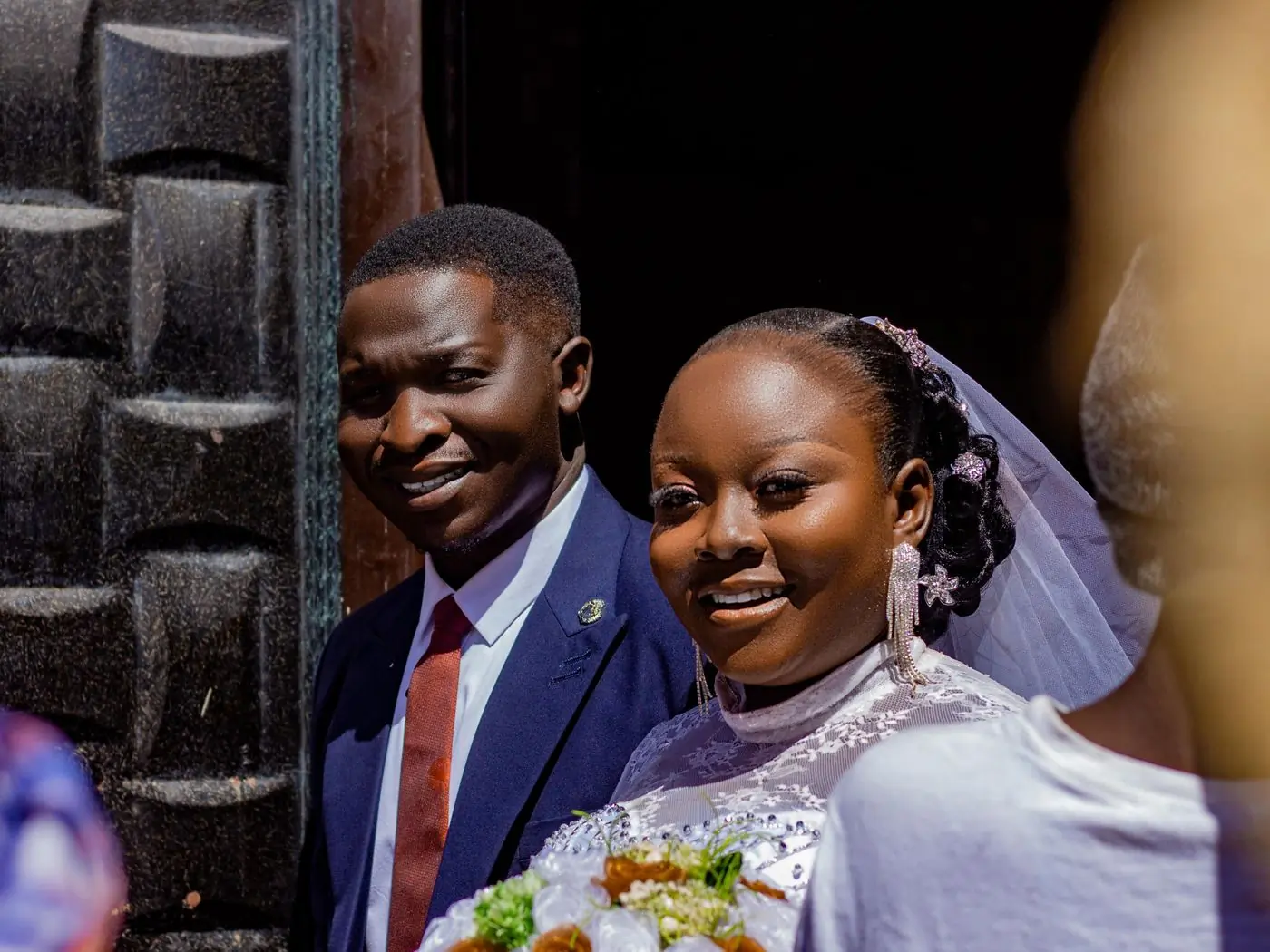 A couple laughing together on their wedding day