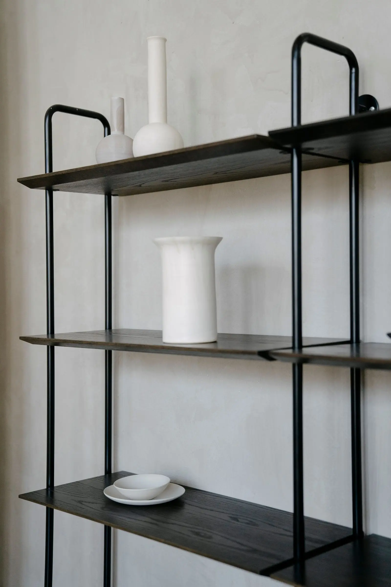 Modular shelving arranged along a wall