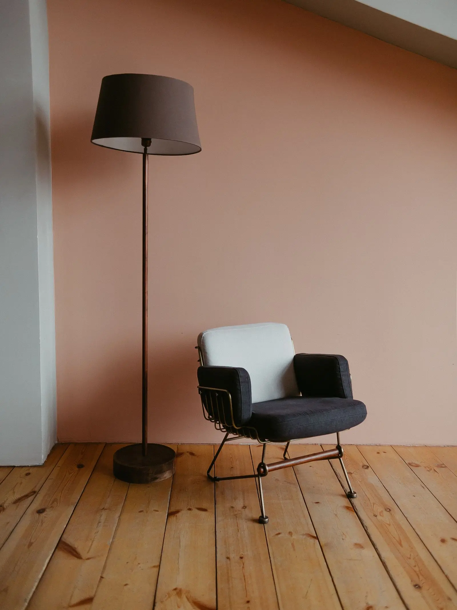 A floor lamp glowing in a minimal setting