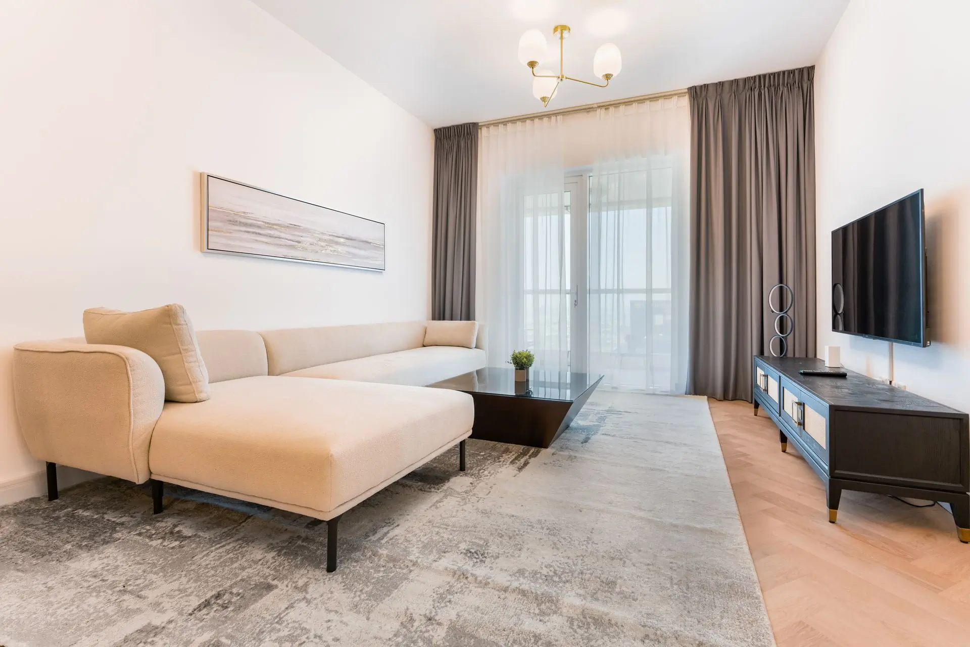 A calm modern living room furnished by Alcove