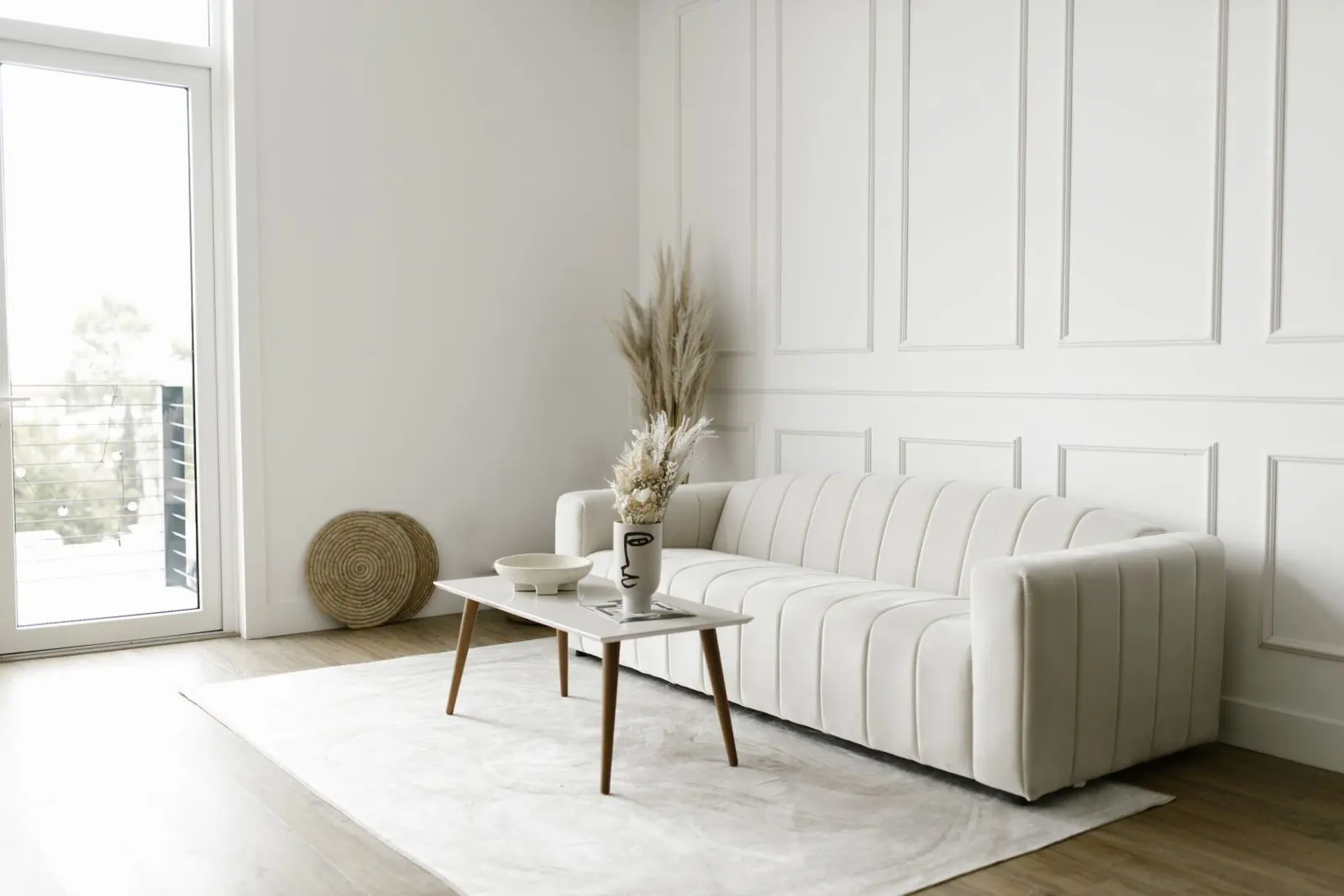 A warm beige fabric sofa with soft cushions