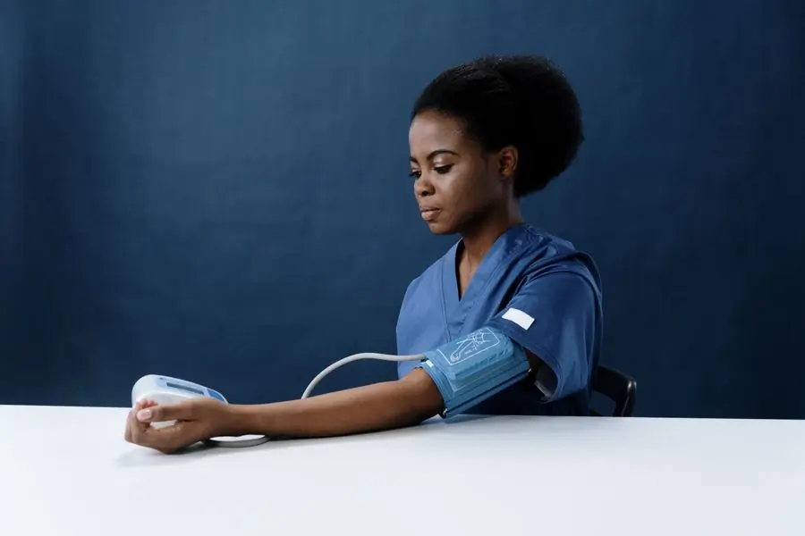 A nurse taking a patient's blood pressure