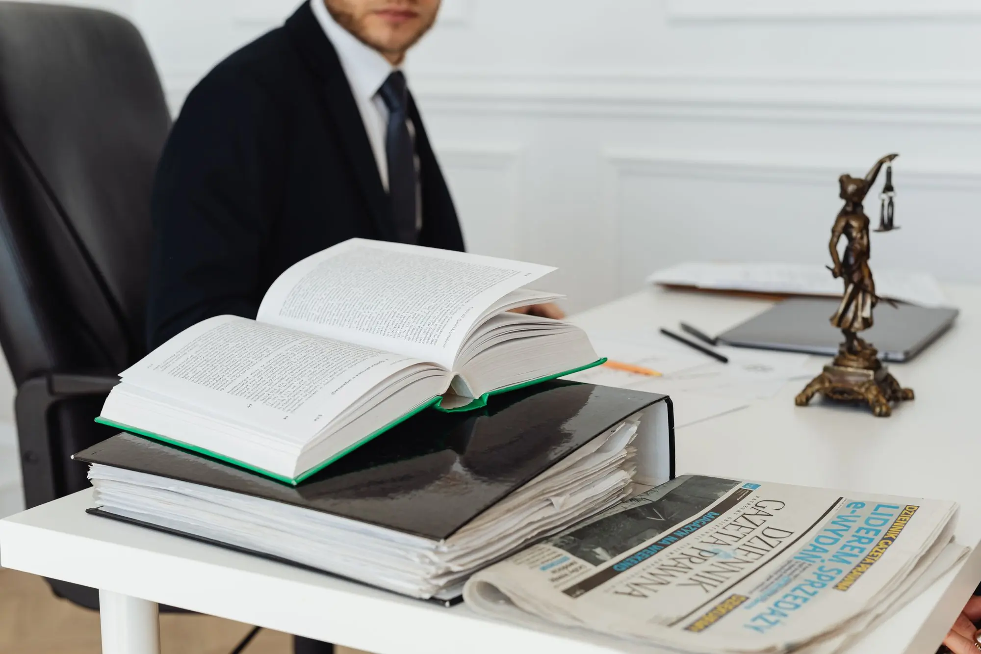 An attorney reviewing statute books at a desk