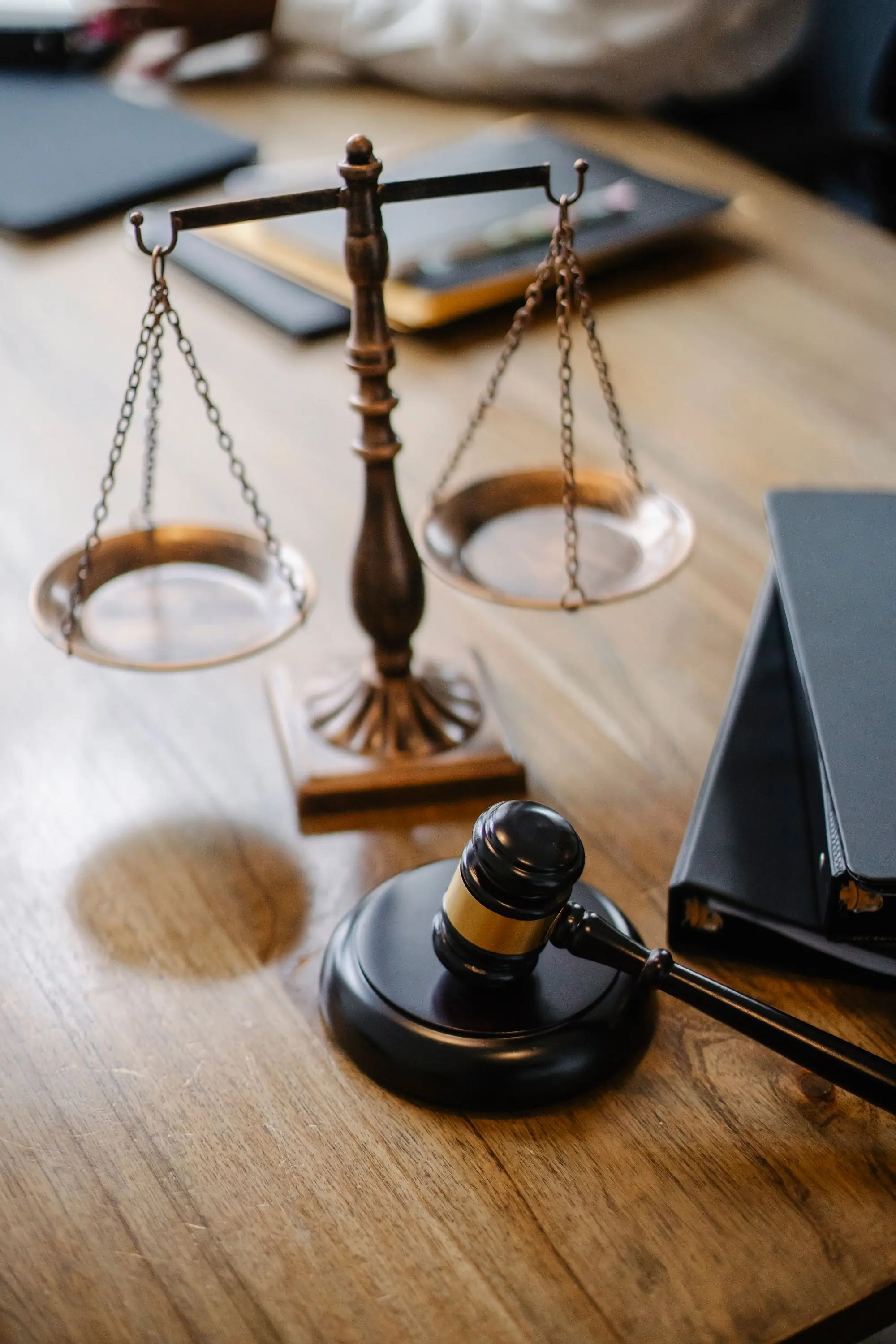 Scales of justice and a gavel on a lawyer's desk