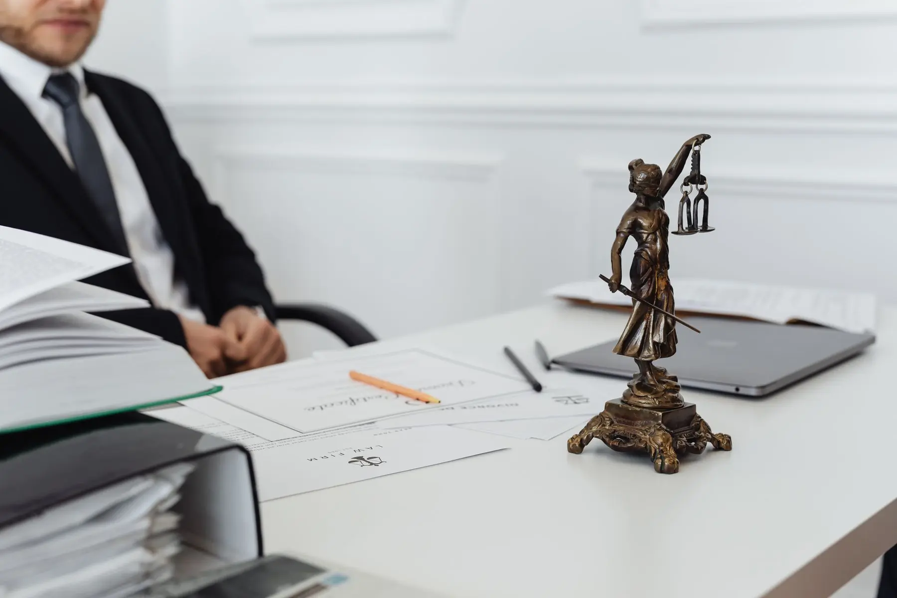 An employment file open on a desk