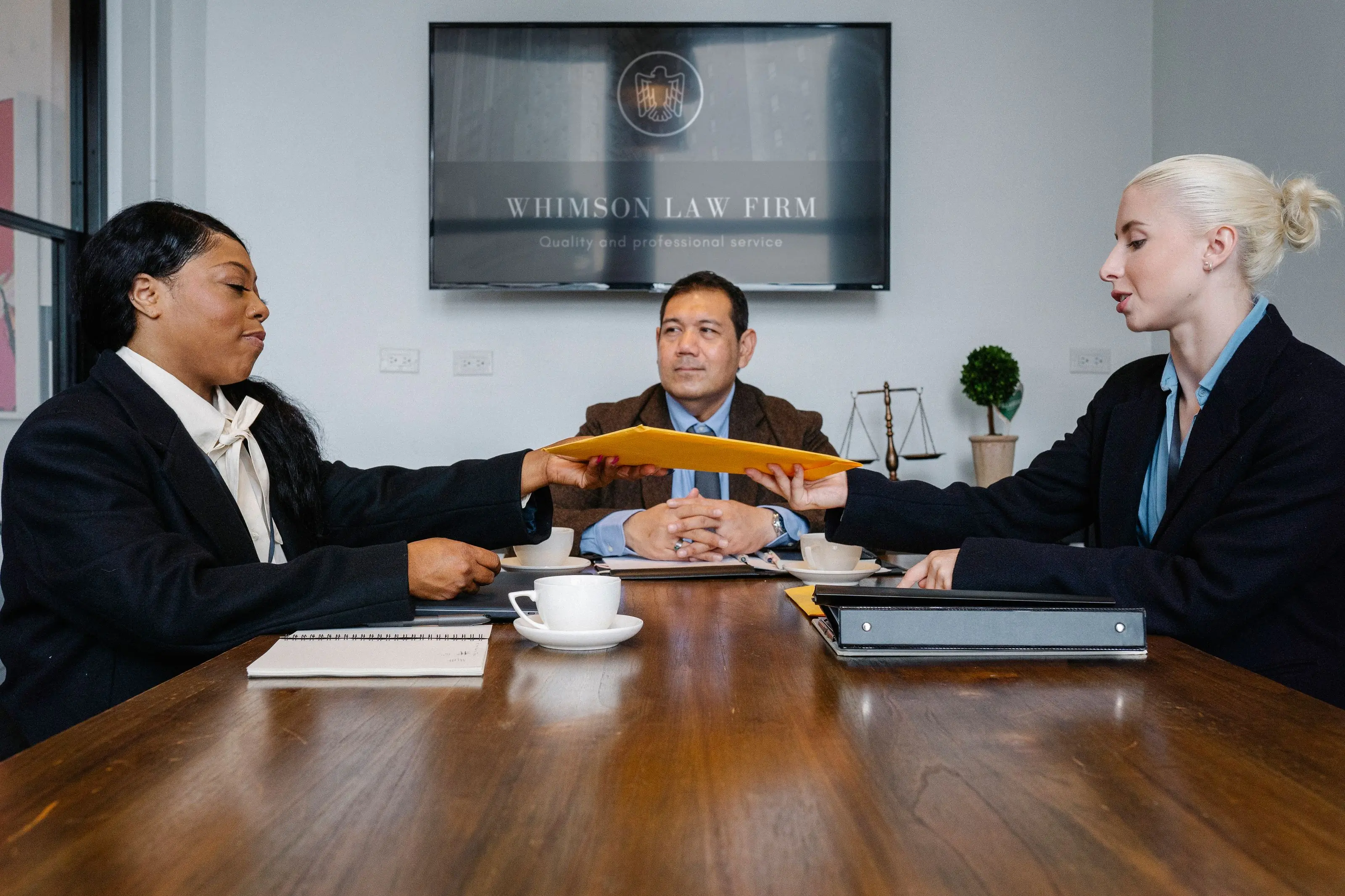 A litigation team reviewing a case file together