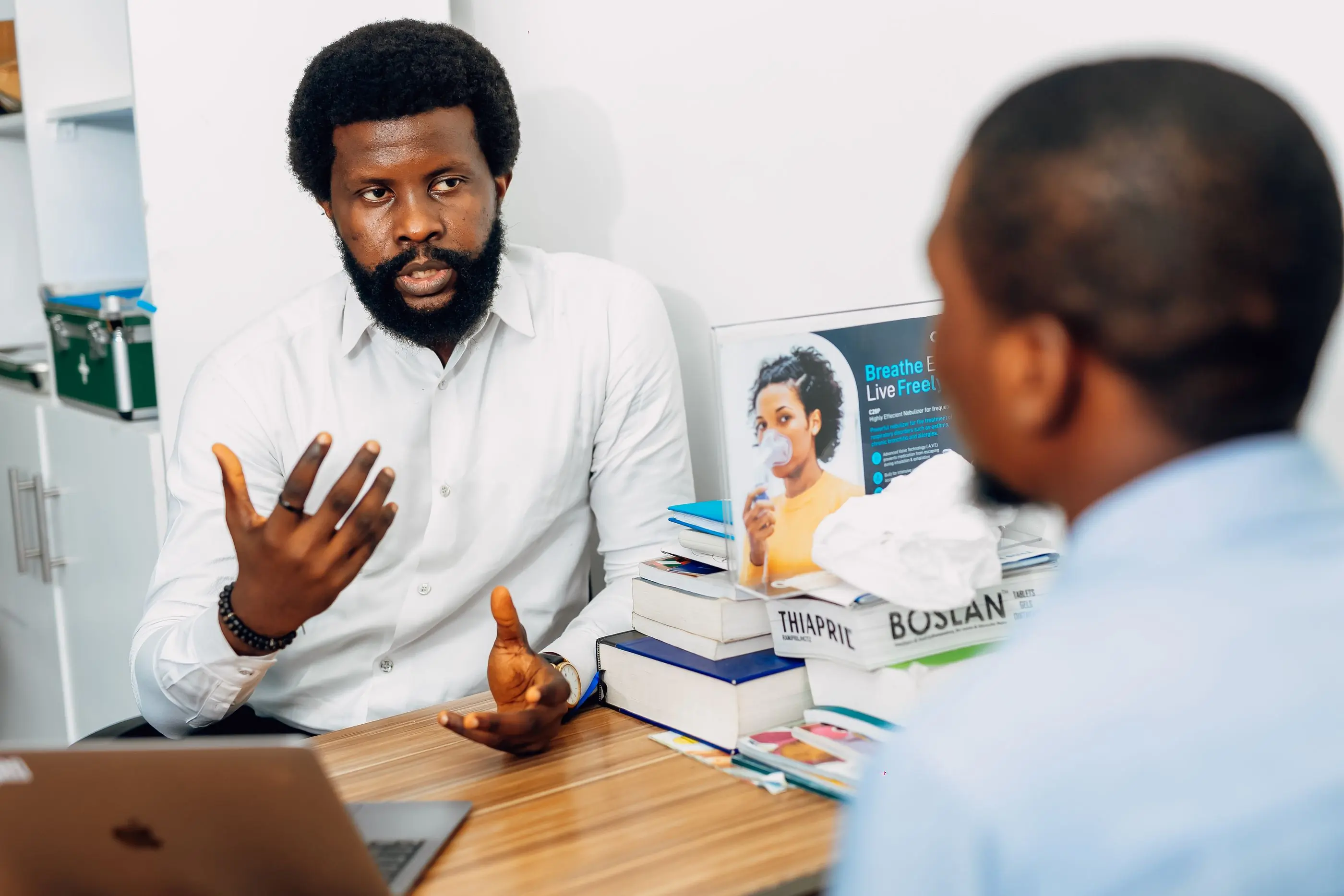 A doctor going through a set of results with a patient
