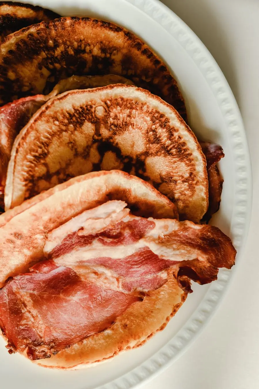 Pancakes served with crisp bacon