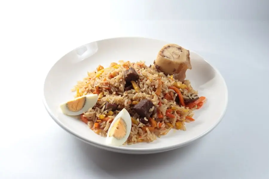A dish of rice with vegetables and egg