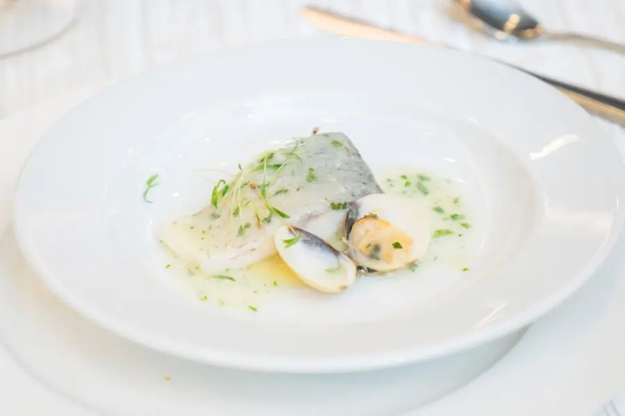 Seafood plated with citrus and herbs