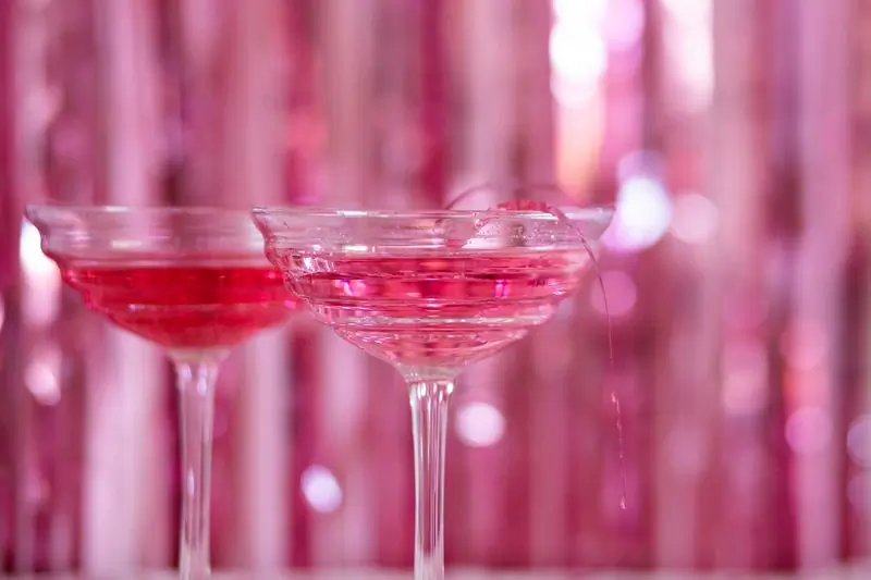 Two coupes of a pink cocktail