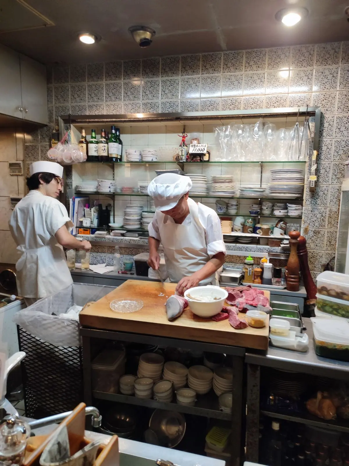 Two chefs working the line at Basil
