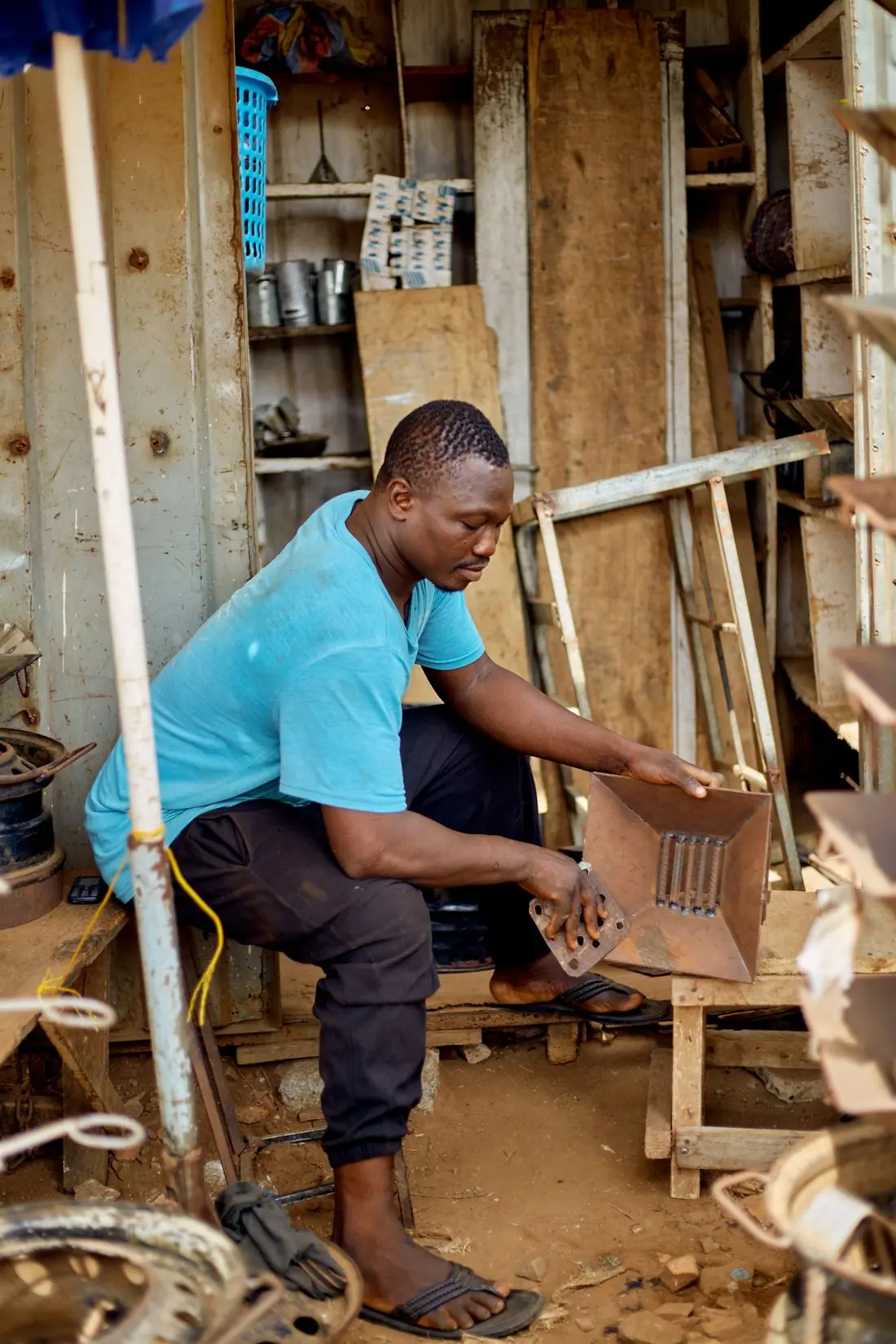 A Beacon fitter working metal in the yard