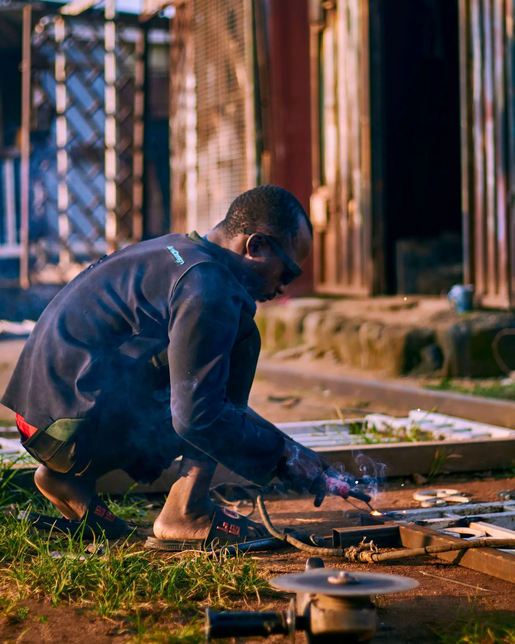 A Beacon fitter welding up a bracket in the yard