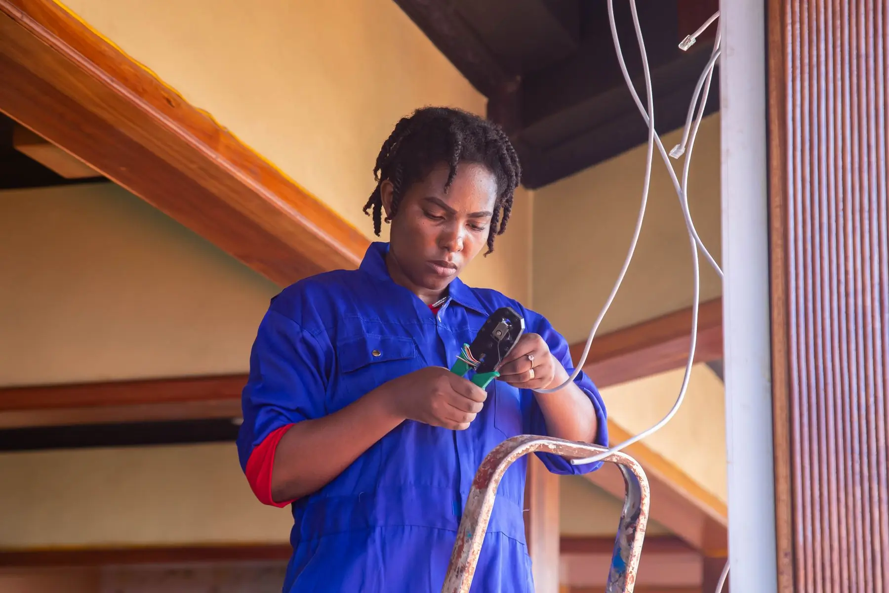 An electrician making off a lighting circuit on a Beacon job