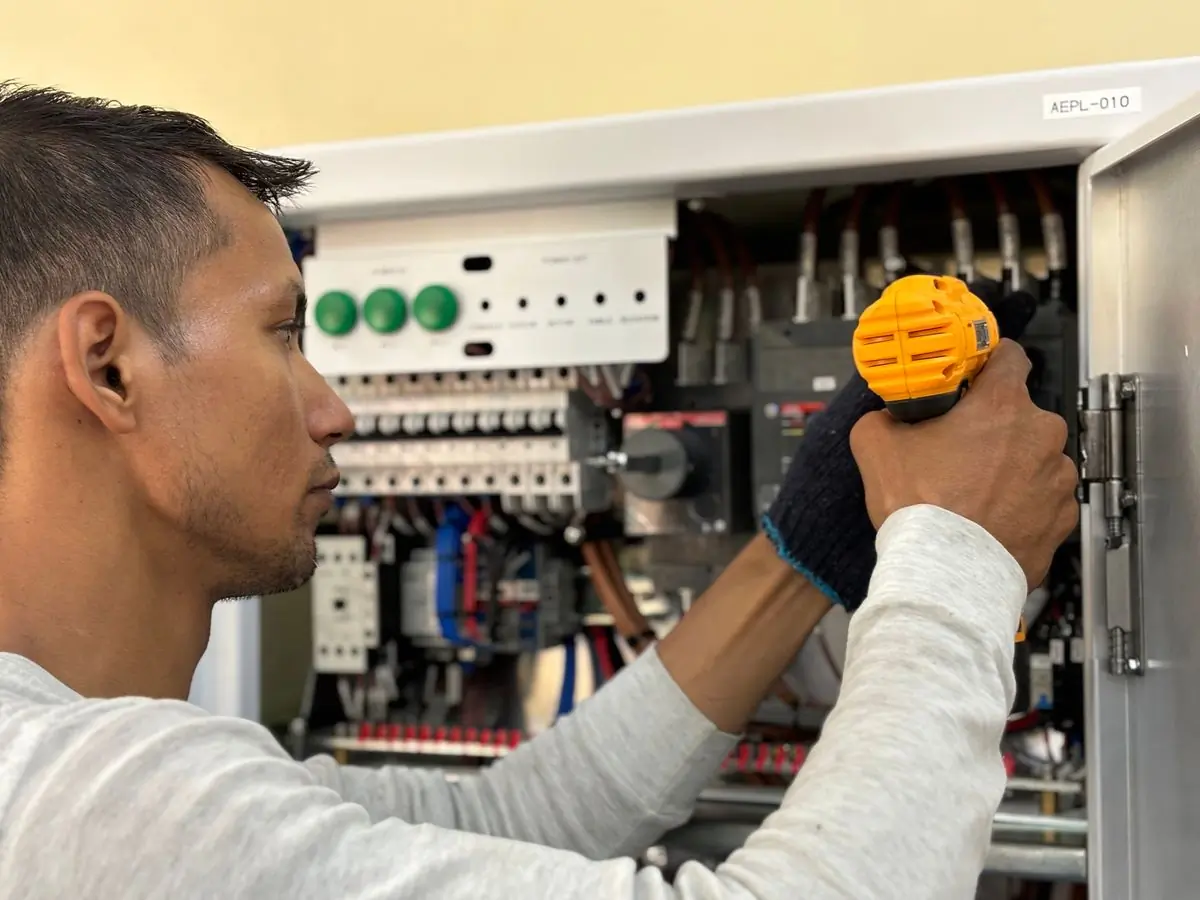 An electrician terminating circuits in a new consumer unit