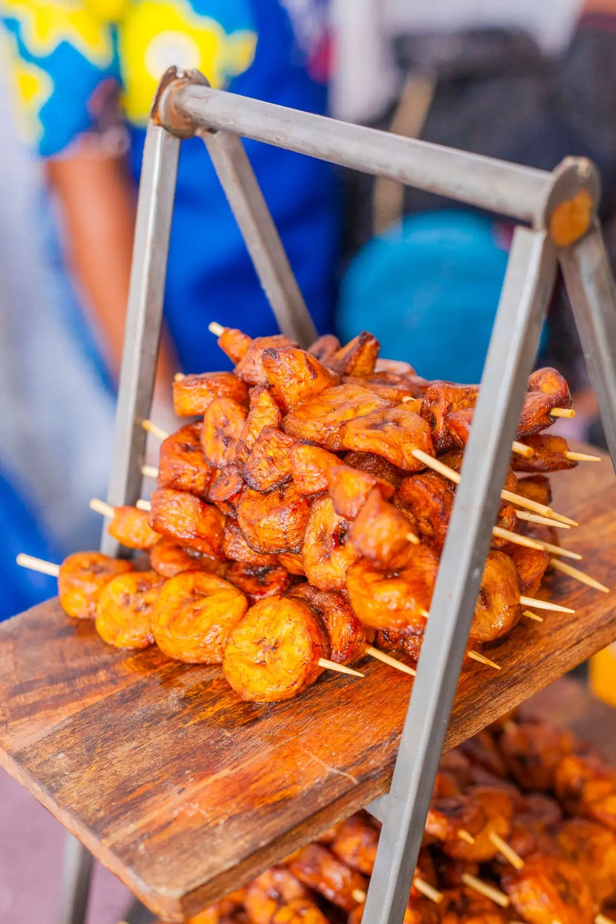 Plantain skewers grilled over charcoal