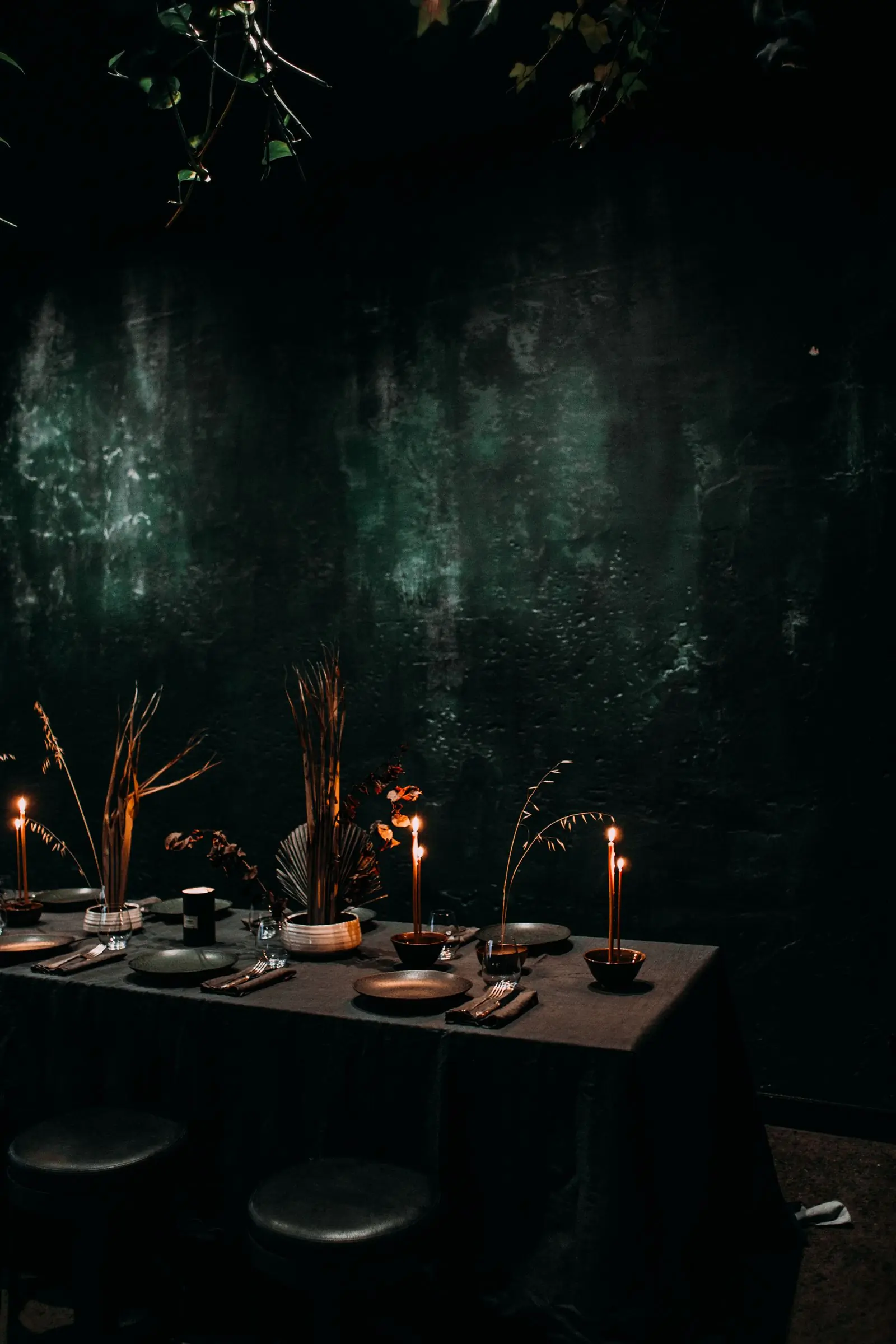 The dining room lit with candles before a private evening