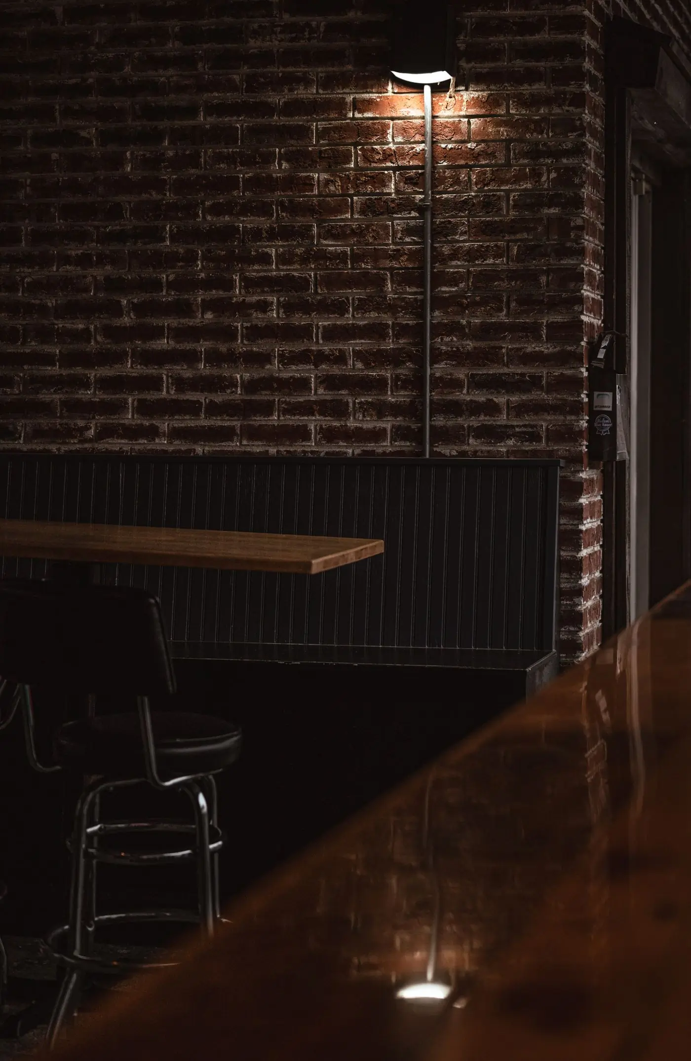The private room, bare brick and a single long table