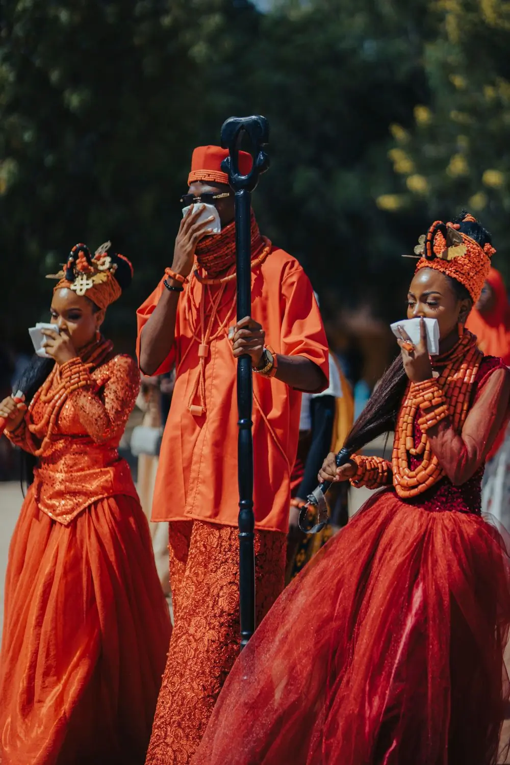 Guests in vibrant traditional attire at a ceremony