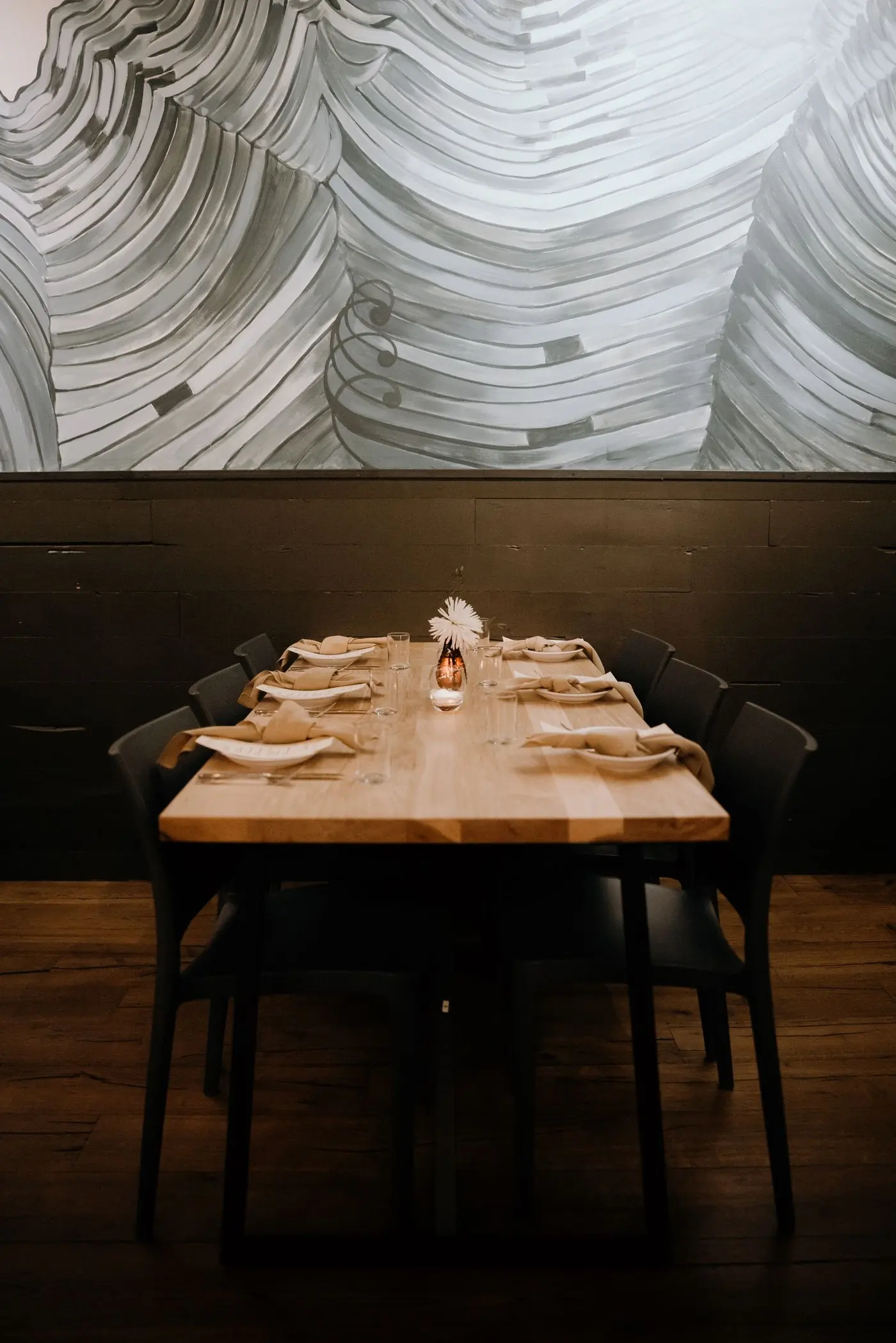 A table laid and waiting in the front room at Feast