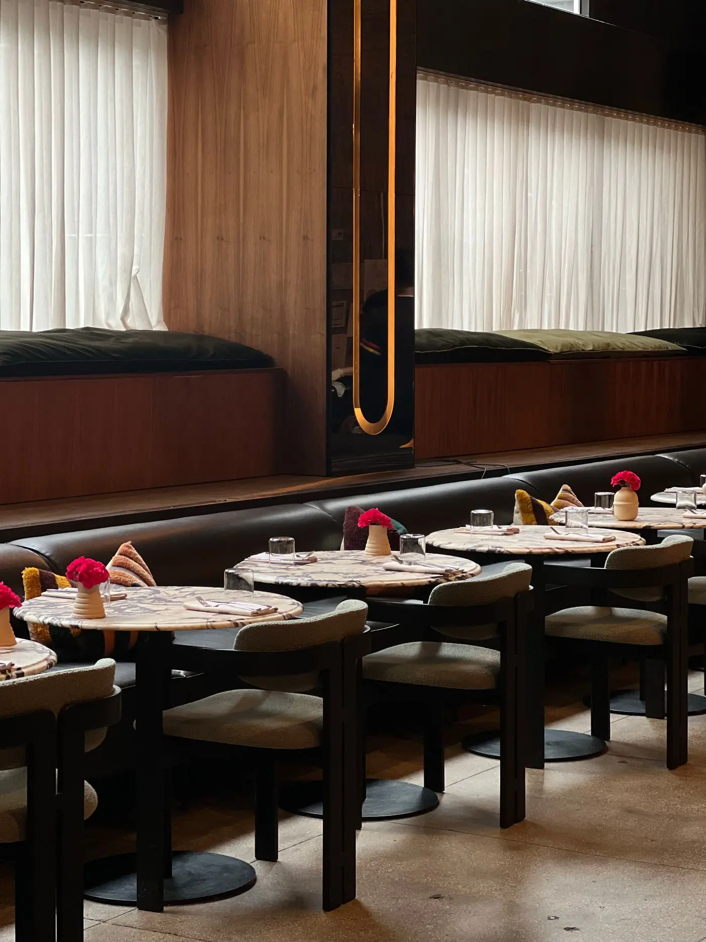 Tables laid across the room at Feast before a private evening