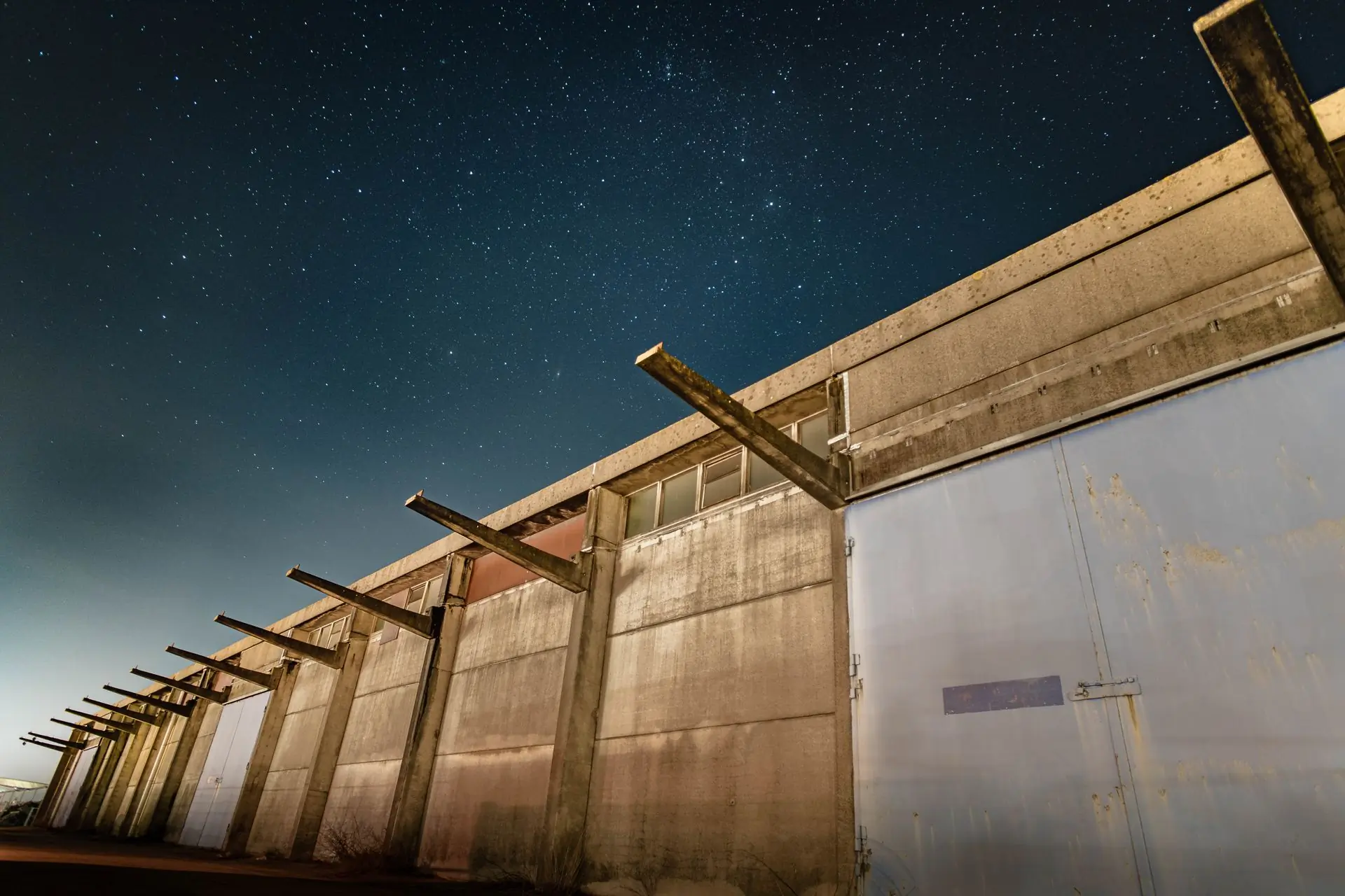 A concrete structure standing against the night sky