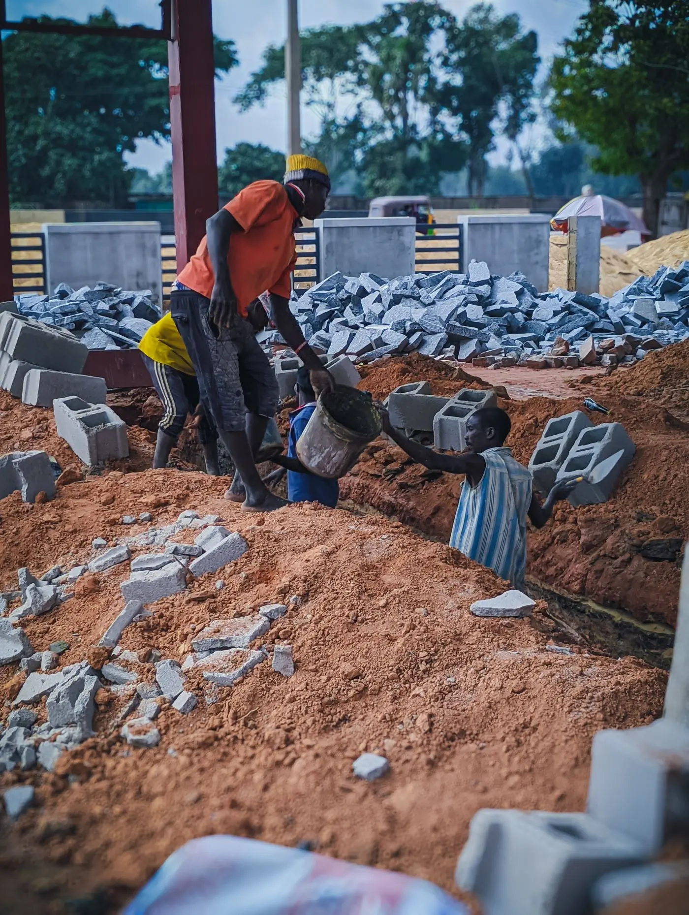 Blockwork going up over a strip foundation on red earth