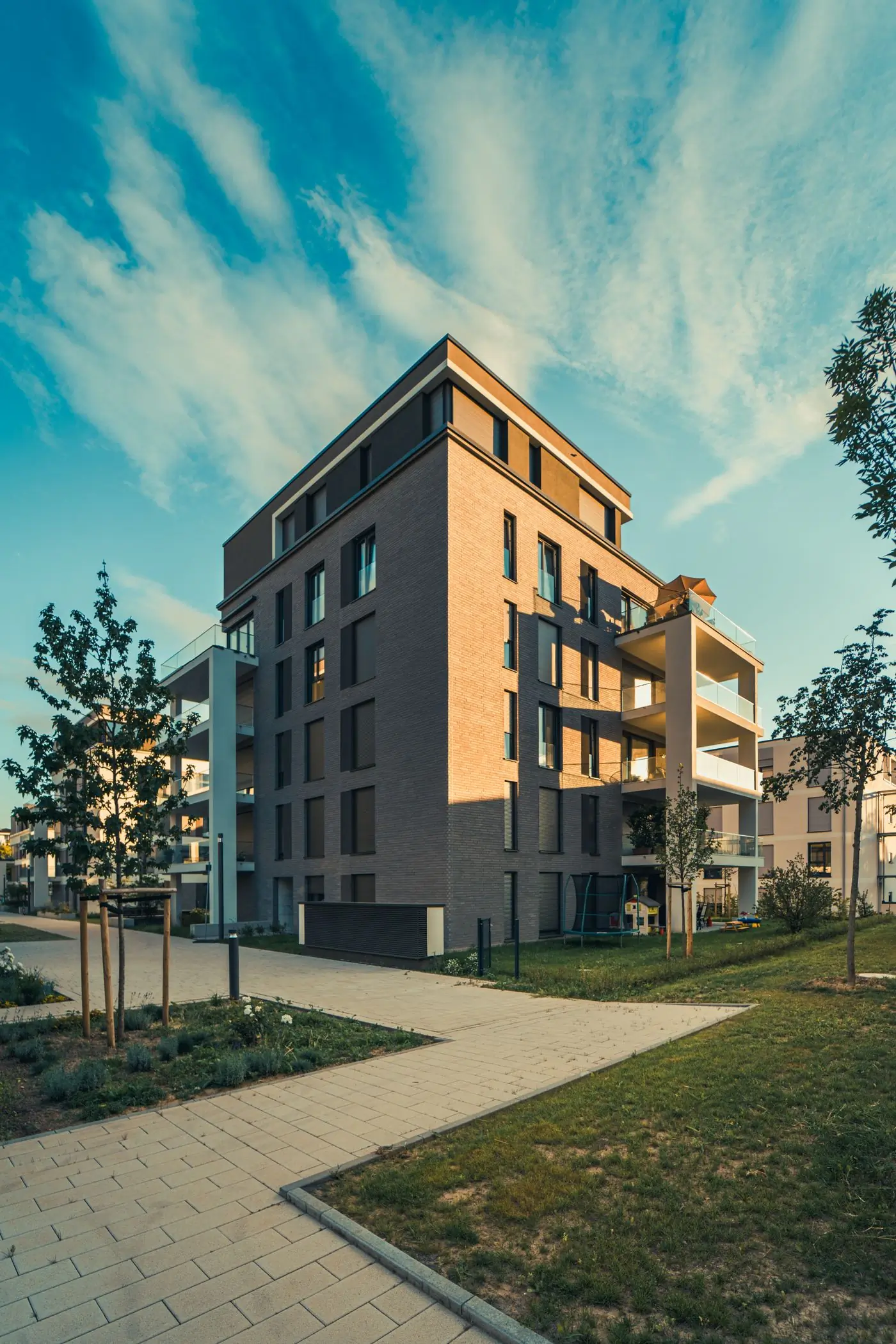 A completed apartment block with its landscaping in