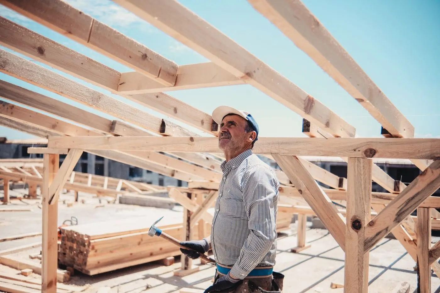 A foreman checking the line of a new rafter run
