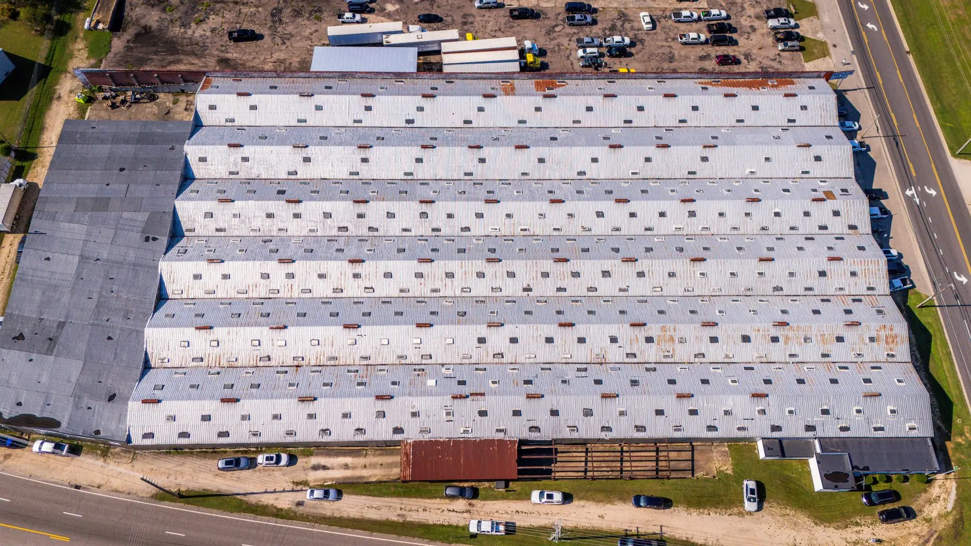 A large commercial warehouse roof photographed from the air