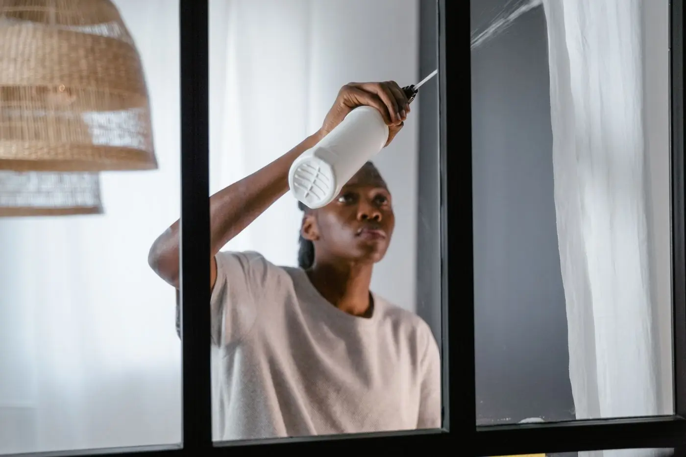 A cleaner working across the glass of a commercial frontage