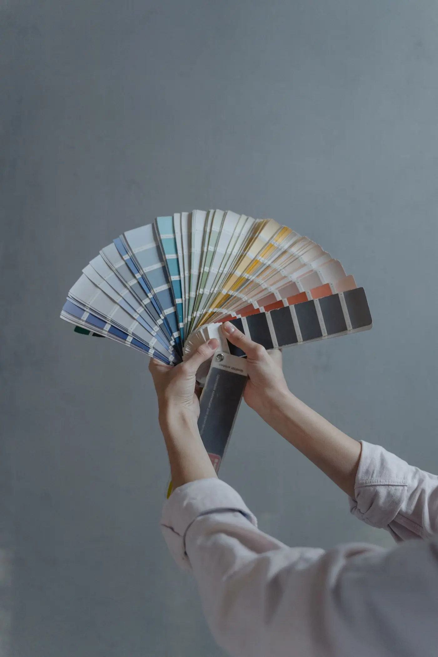 A colour consultant fanning out the firm's swatch deck