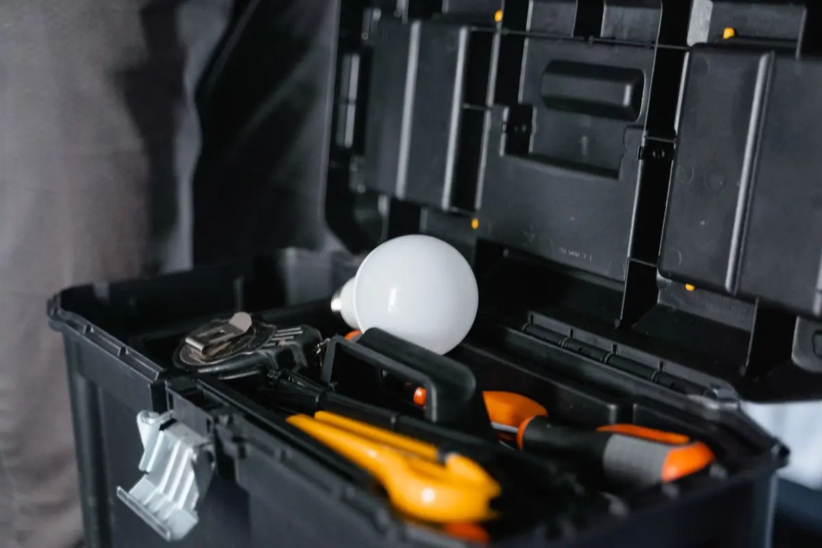 An open tool box with a bulb resting in it