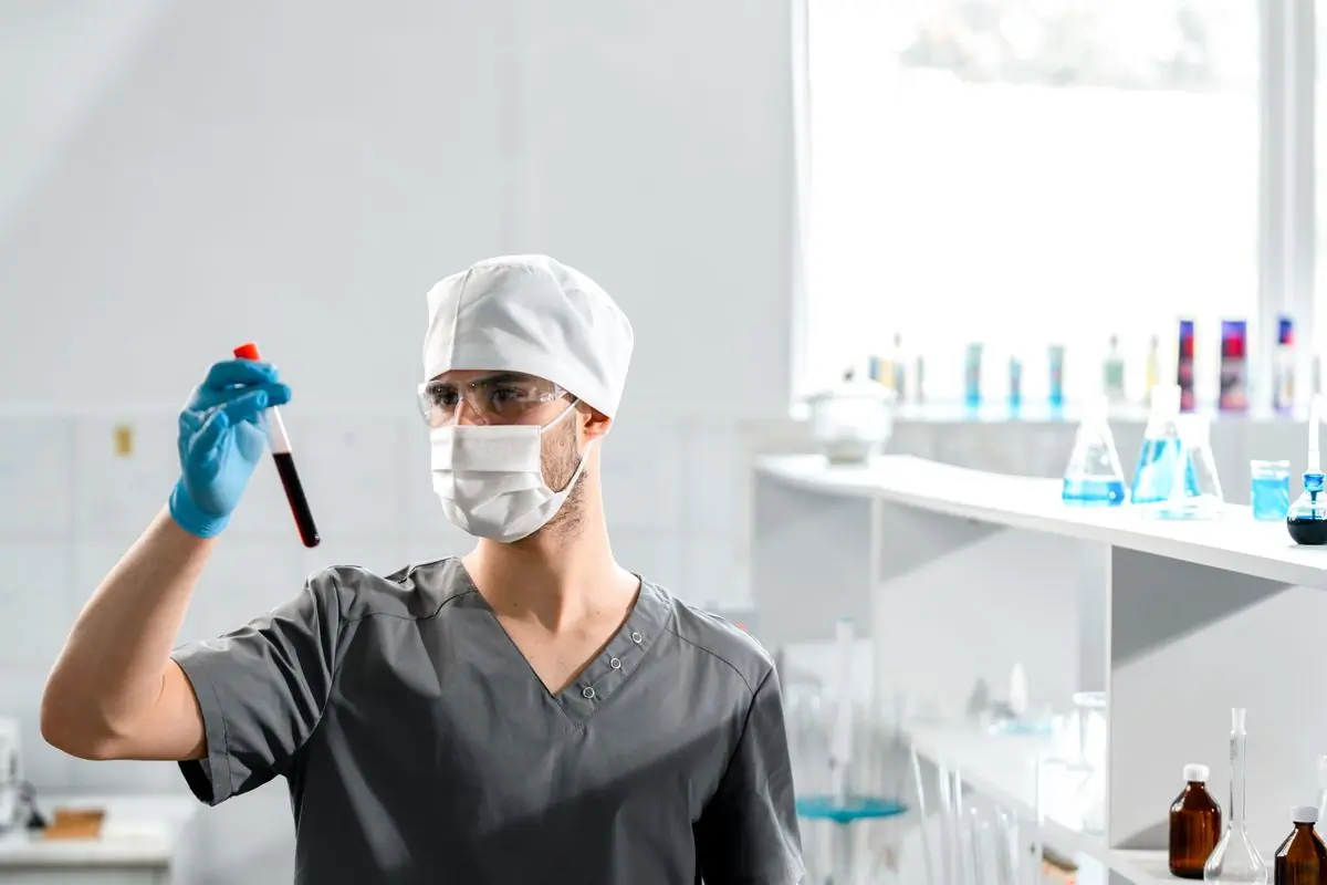 A laboratory scientist preparing a blood sample for analysis