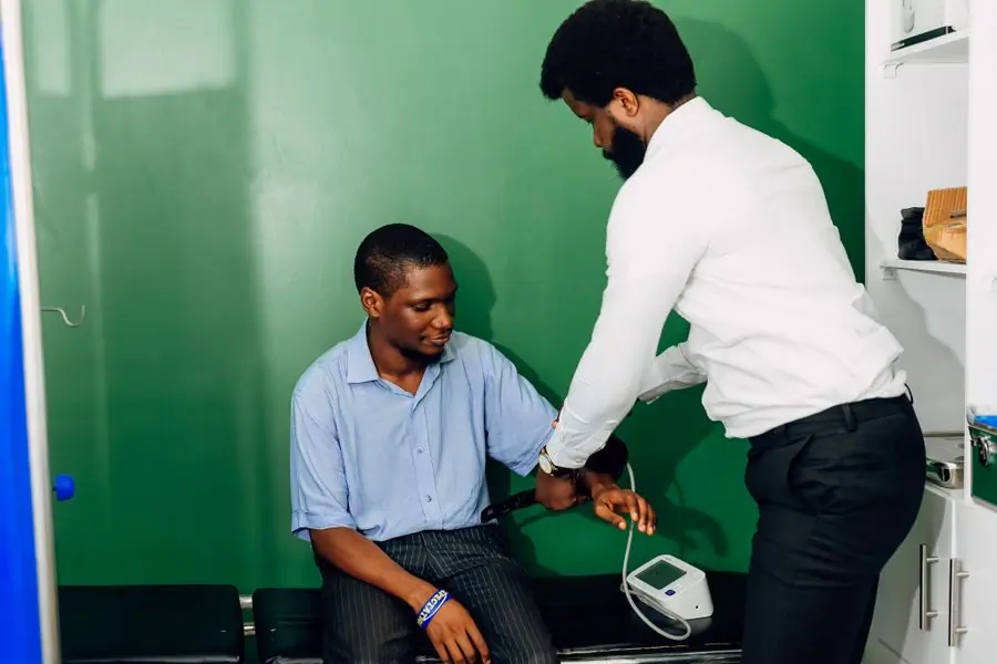 A patient having their blood pressure taken at an outpatient clinic