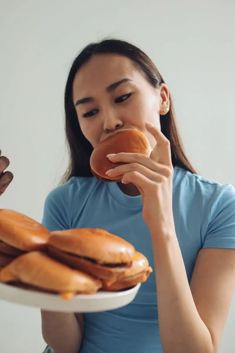 A guest about to bite into a cheeseburger