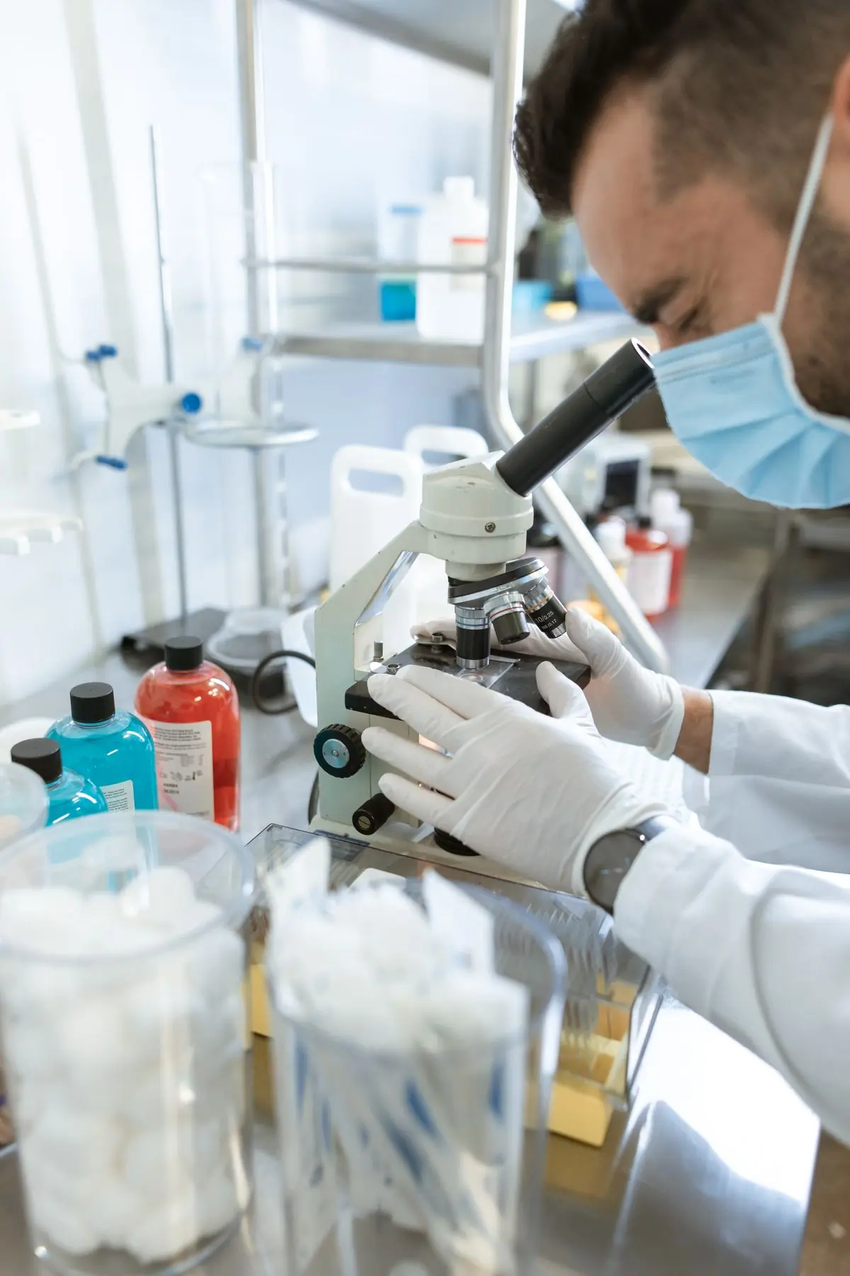 A laboratory scientist working at a microscope