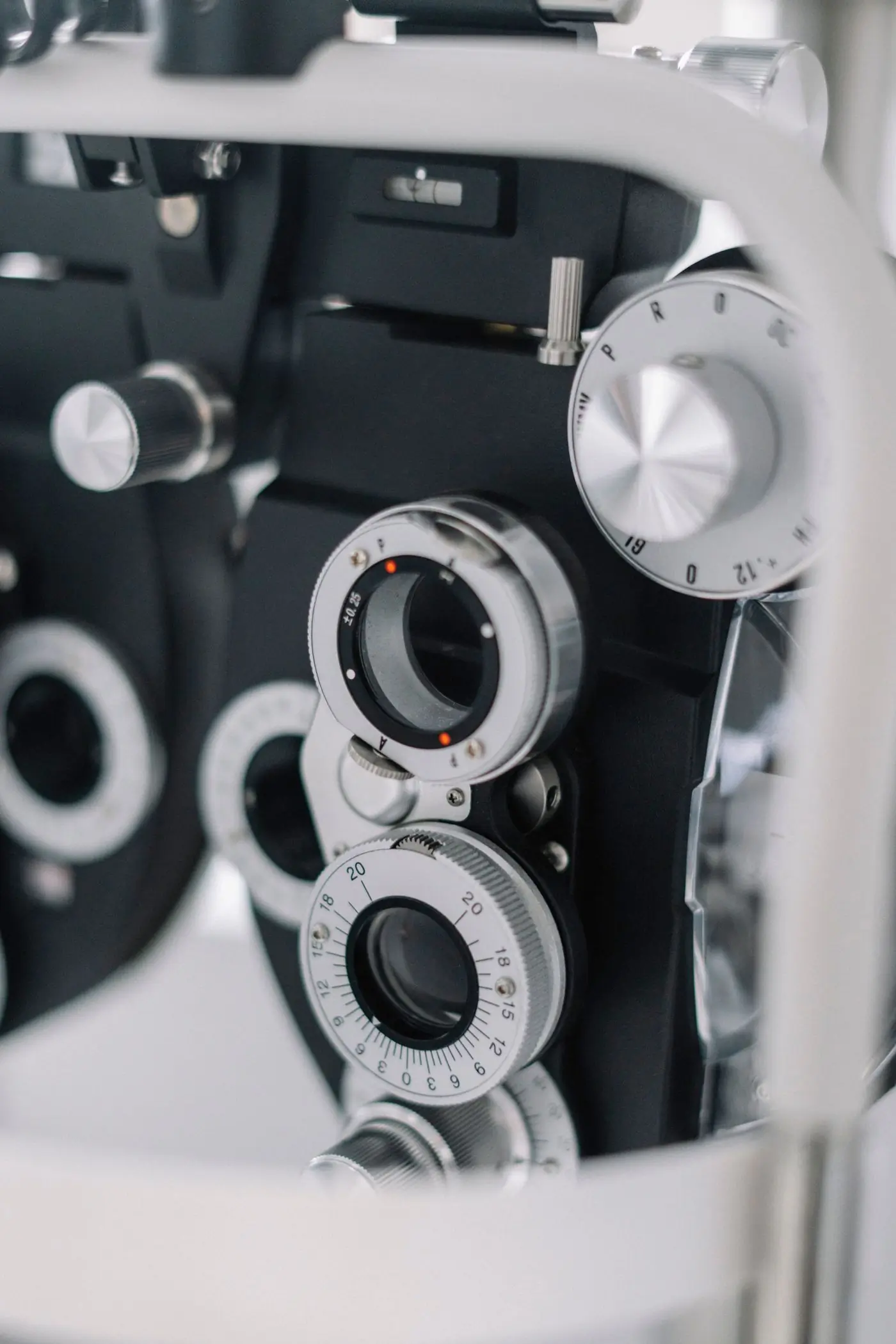 Close view of the dials on an optical instrument