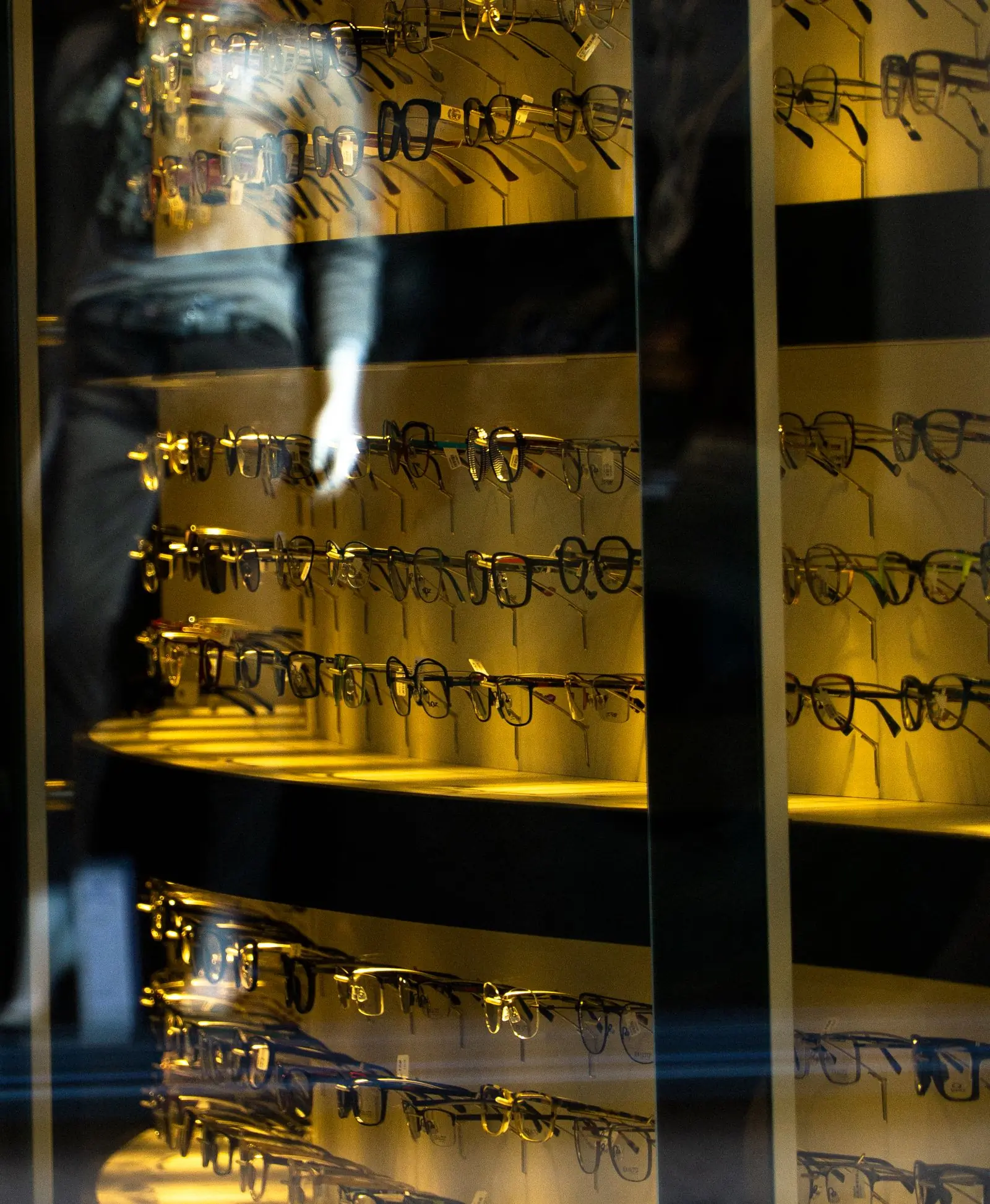 Frames displayed in a warm-lit cabinet