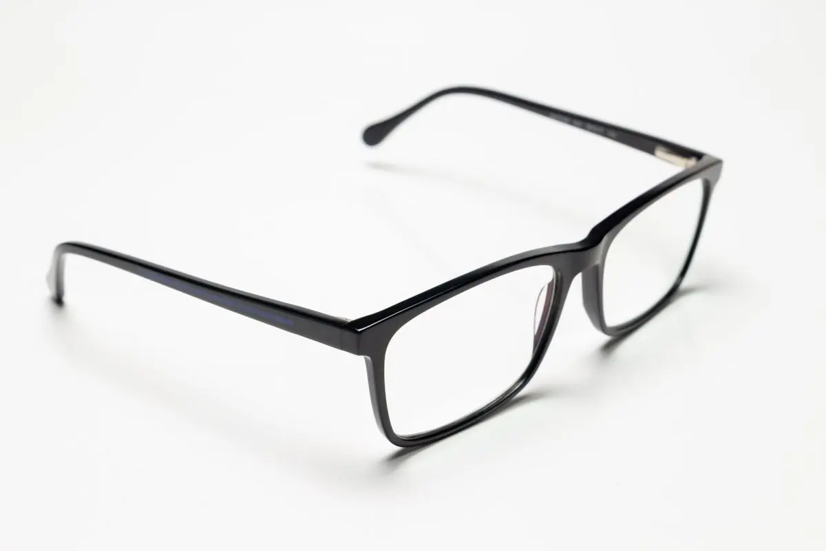 Black acetate rectangular optical frames photographed straight on against white