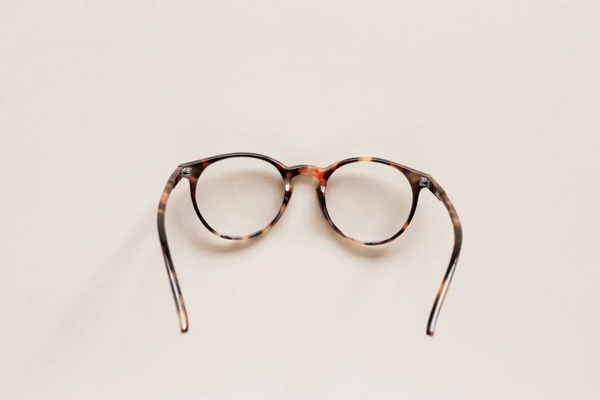 Round tortoiseshell optical frames photographed from above on white