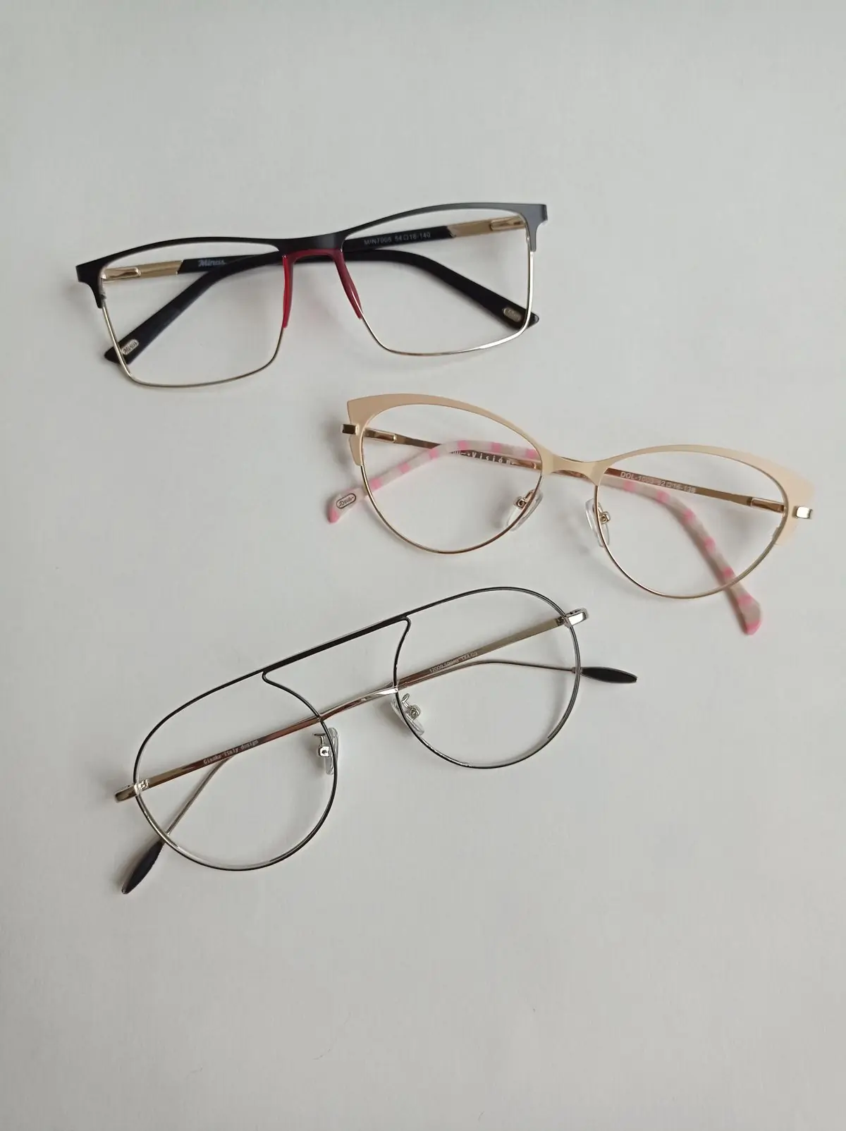 Three pairs of frames laid out in a row on a white surface
