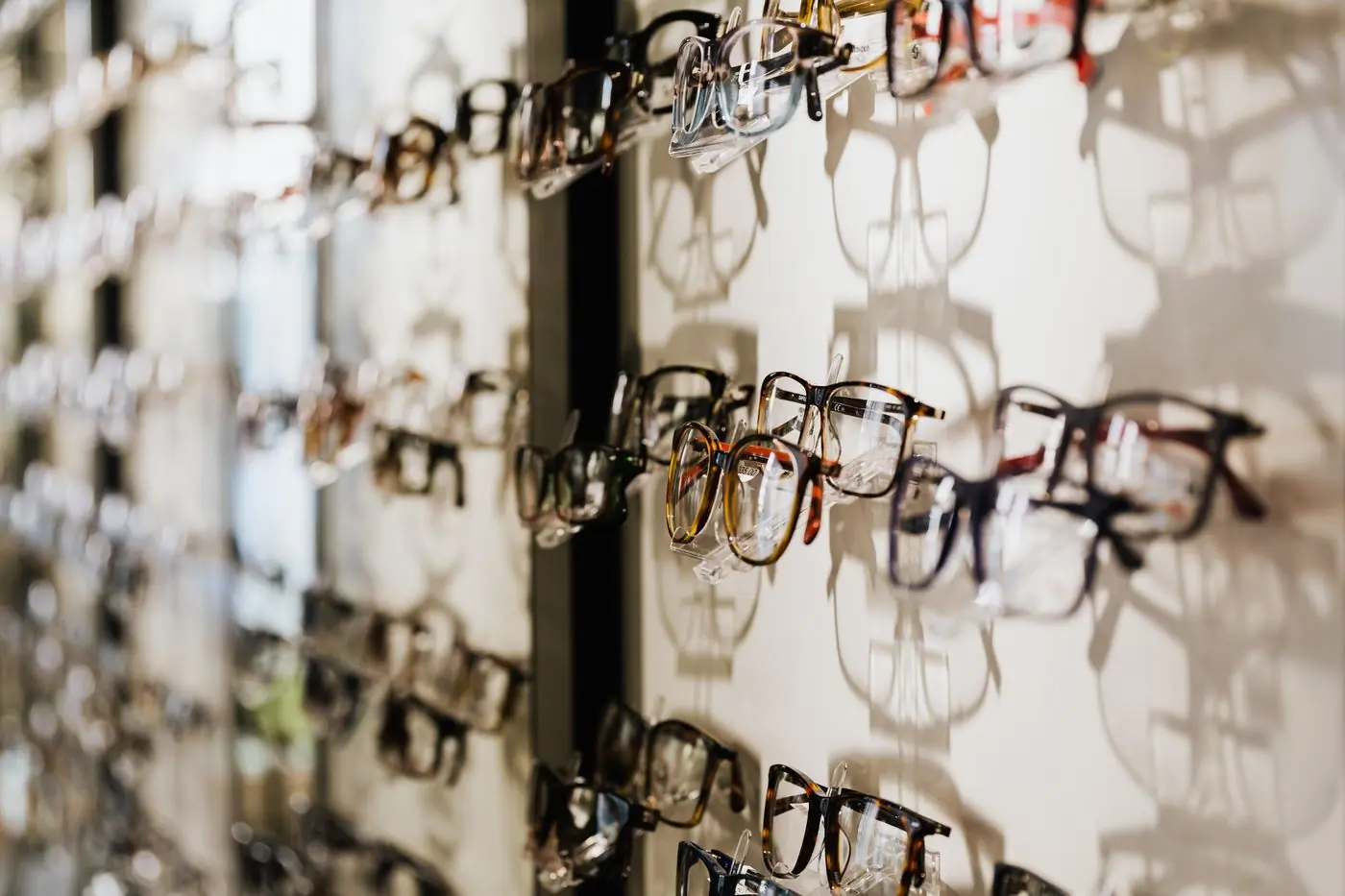 Rows of optical frames on a shop wall