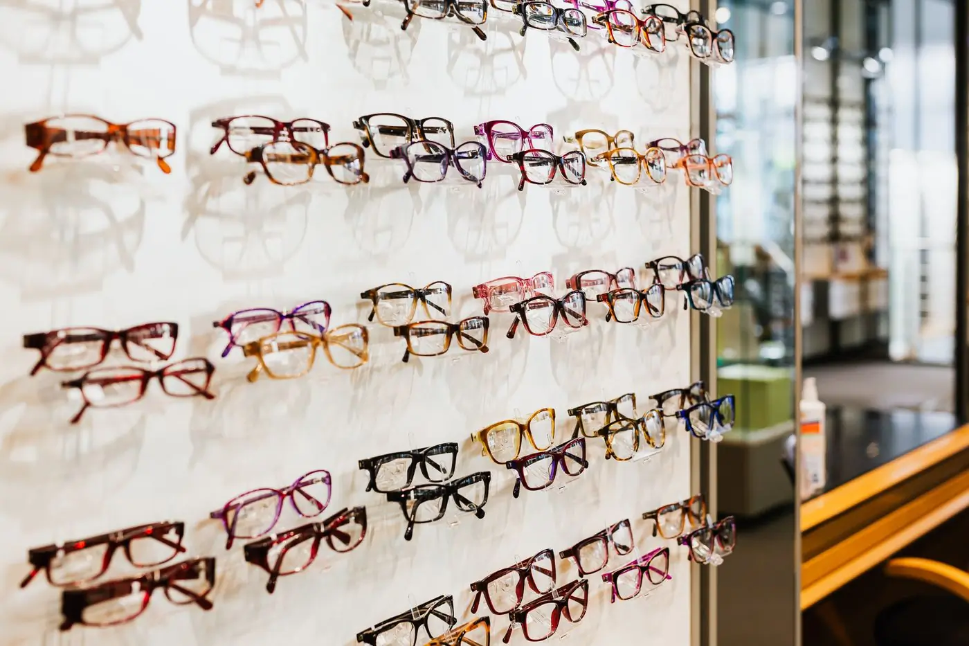 Colourful optical frames on a lit wall display