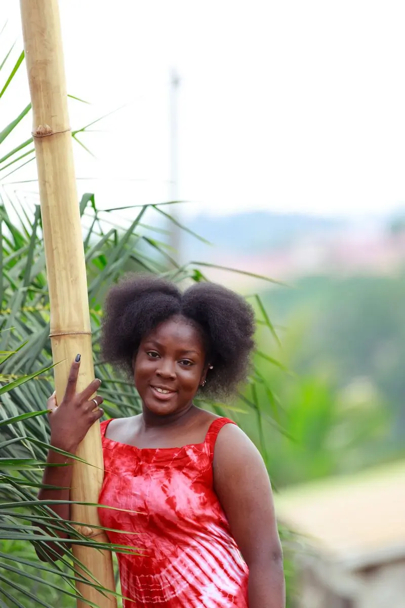 A rites coordinator standing among tall green stems